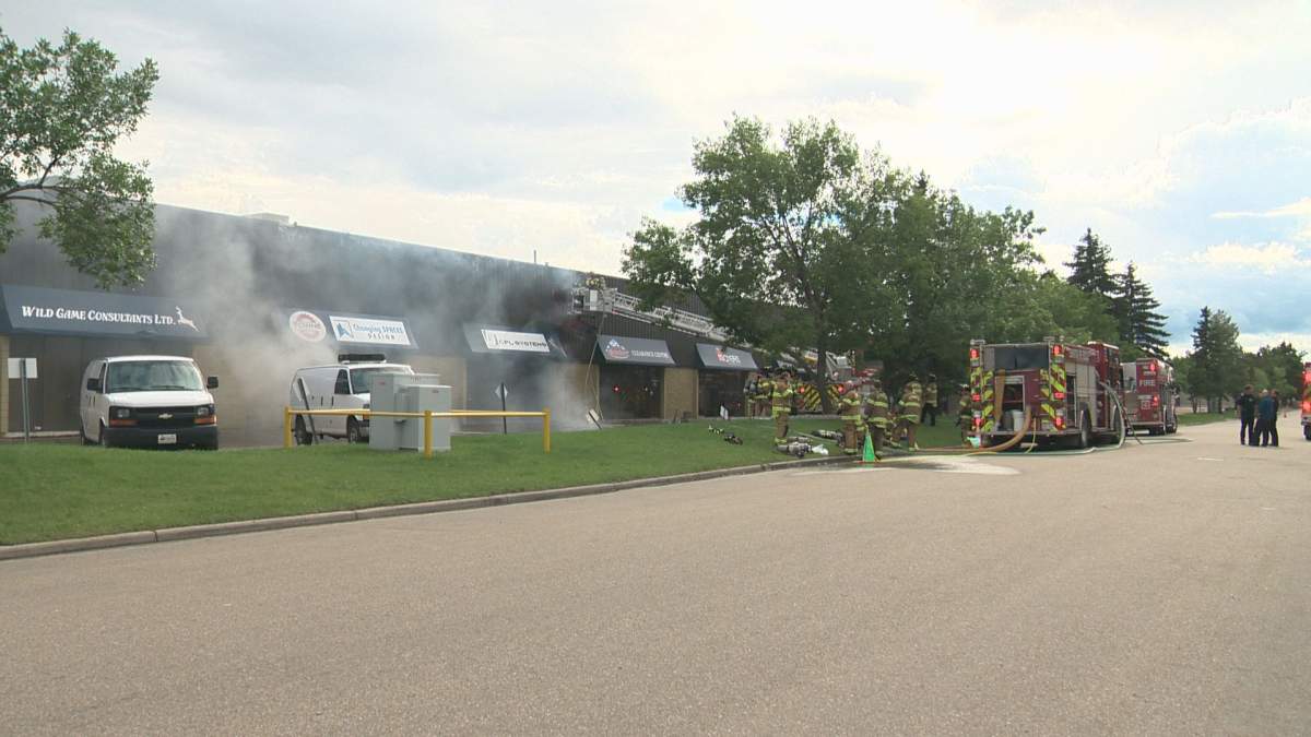 Edmonton Fire Rescue Services battle a blaze at a strip mall in Edmonton's west end on Saturday.