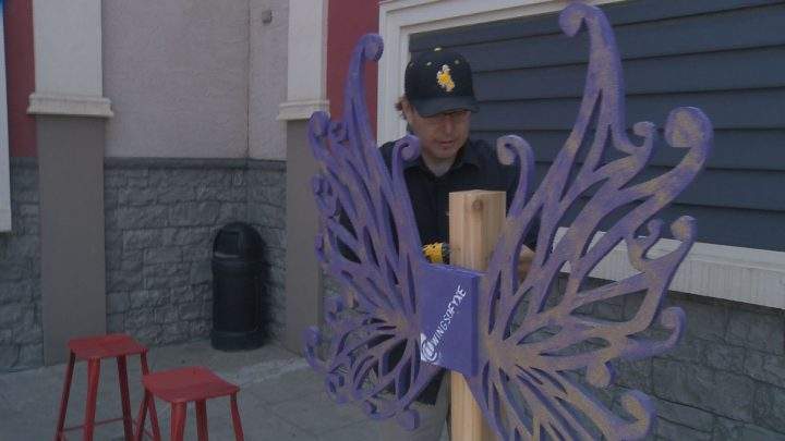 Loch Willy puts up a set of wings in front of Jerry’s Food Emporium.