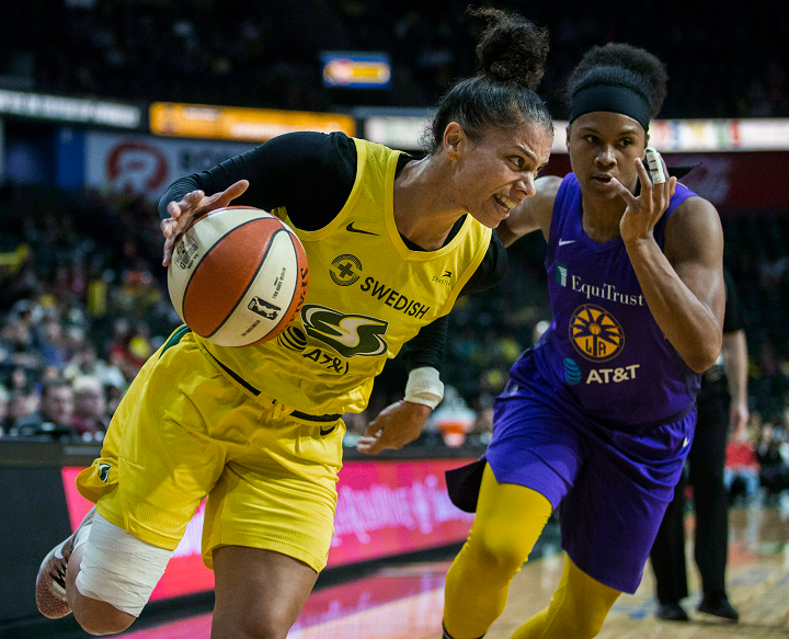 Seattle Storm's Alysha Clark drives against a Los Angeles Sparks player during a WNBA basketball game Friday, June 21, 2019, in Everett, Wash. 