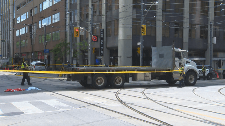 A woman has died after being hit by a truck in downtown Toronto Wednesday morning.