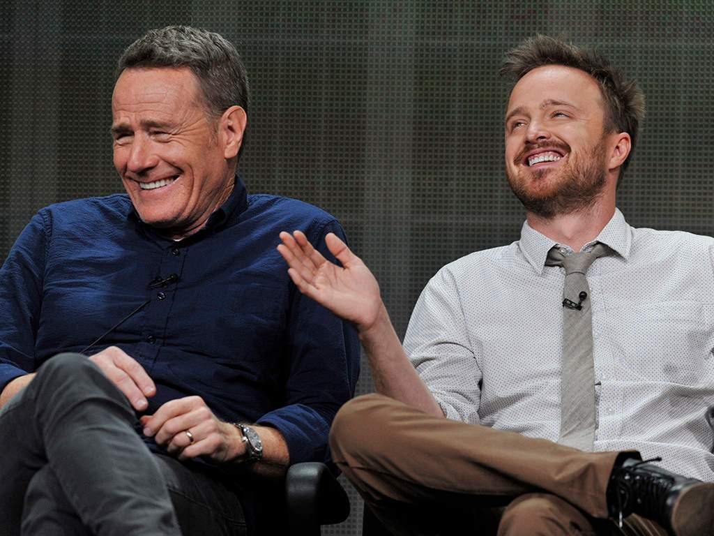 Bryan Cranston, left, and Aaron Paul, cast members in the television series 'Breaking Bad,' share a laugh onstage during AMC's Summer 2013 TCA press tour at The Beverly Hilton Hotel on Friday, July 26, 2013, in Beverly Hills, Calif. 