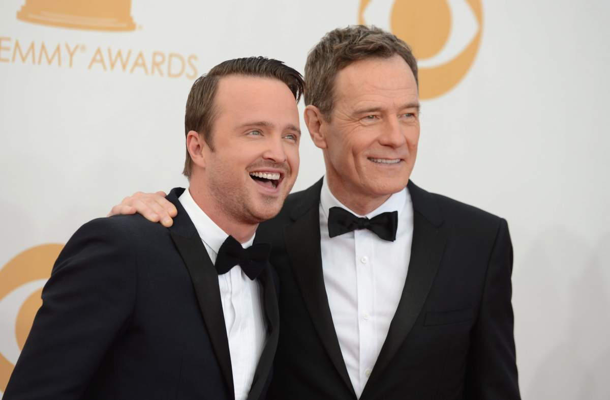 Aaron Paul, left, and Bryan Cranston arrive at the 65th Primetime Emmy Awards at Nokia Theatre on Sunday Sept. 22, 2013, in Los Angeles, Calif.