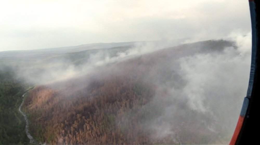 This image made from video provided by RU-RTR Russian television channel shows a view of a forest fire in the Boguchansky district of the Krasnoyarsk region, Russia Far East, Wednesday, July 31, 2019.