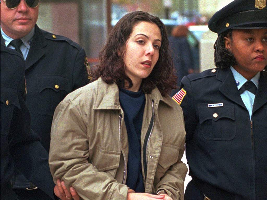 Amy Fisher is escorted into the federal courthouse in Buffalo, N.Y., in this Sept. 26, 1996 photo. March 2, 2002.