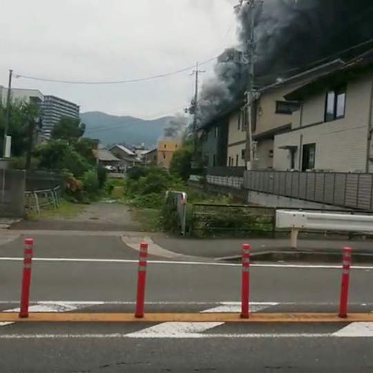 Smoke billows from a fire at the Kyoto Animation studio in Kyoto, Japan July 18, 2019, in this still image obtained from a social media video.