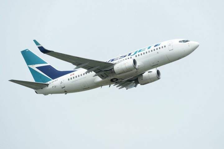 A WestJet plane takes off from Vancouver International Airport in Vancouver on Monday, May 13, 2019. Onex Corp. has signed a friendly deal to buy WestJet Airlines Ltd. in a transaction it valued at $5 billion, including assumed debt. 