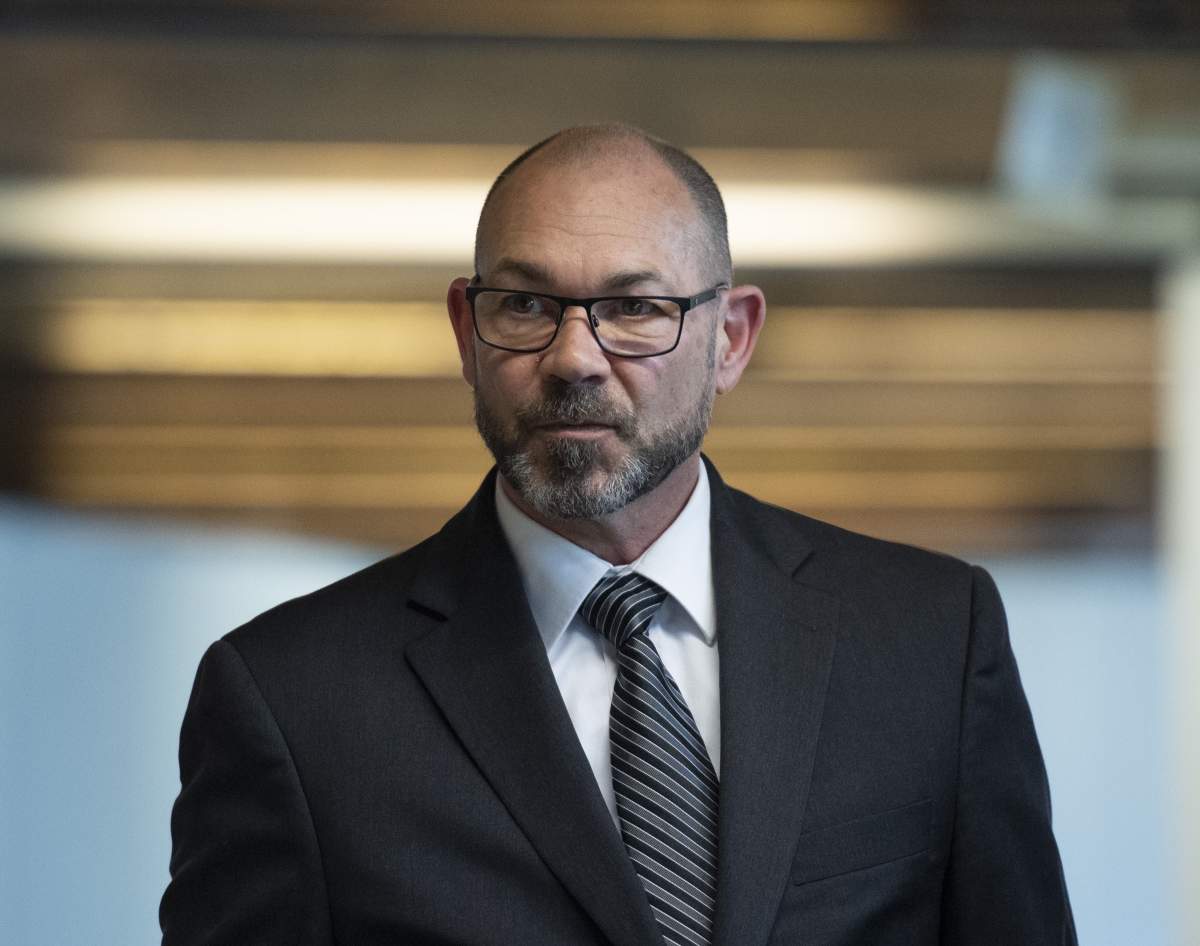 Colonel Mario Dutil returns to the courtroom after a break during his court martial at the Asticou Centre in Gatineau, Que., on June 10, 2019.