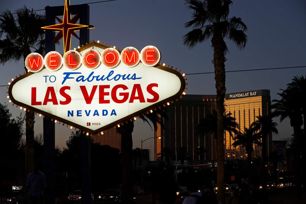 In this Sept. 21, 2018, file photo, the Mandalay Bay hotel and casino reflects the last sunlight of the day along the Las Vegas Strip in Nevada.