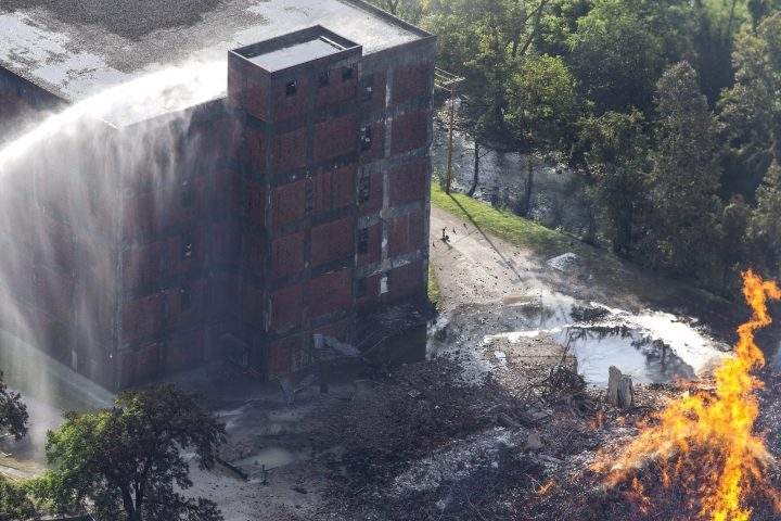 Flames and smoke rise from a bourbon warehouse fire at a Jim Beam distillery in Woodford County, Ky., Wednesday, July 3, 2019.