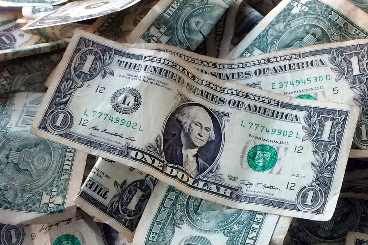FILE - This Oct. 24, 2016, file photo shows dollar bills in New York.