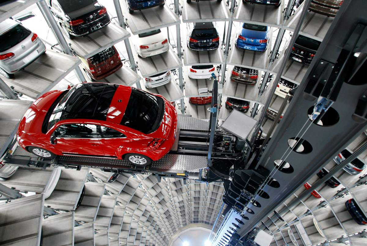 In this March 12, 2012, file photo a Volkswagen New Beetle car is lifted inside a delivery tower after the company’s annual press conference in Wolfsburg, Germany. Volkswagen is halting production of the last version of its Beetle model in July 2019 at its plant in Puebla, Mexico, the end of the road for a vehicle that has symbolized many things over a history spanning eight decades since 1938. (AP Photo/Michael Sohn, File)
