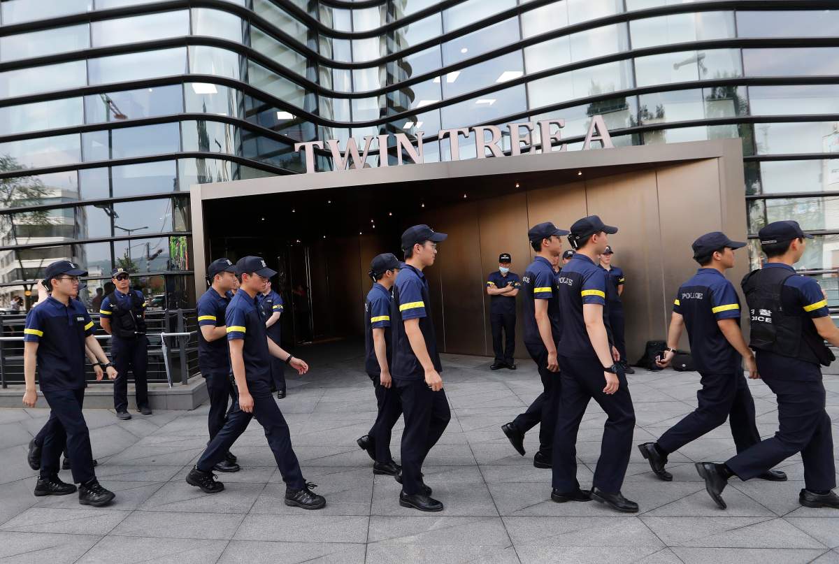 South Korean police officers patrol against possible rallies against Japan in front of a building where the Japanese embassy is located in Seoul, South Korea, Friday, July 19, 2019.