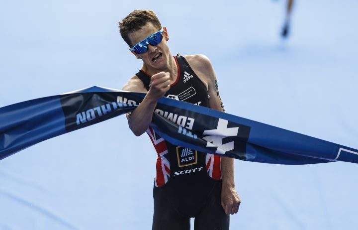 Jonathan Brownlee of Great Britain crosses the finish line for the win during the Elite Men's event at the ITU World Triathlon Series in Edmonton on Saturday, July 20, 2019.