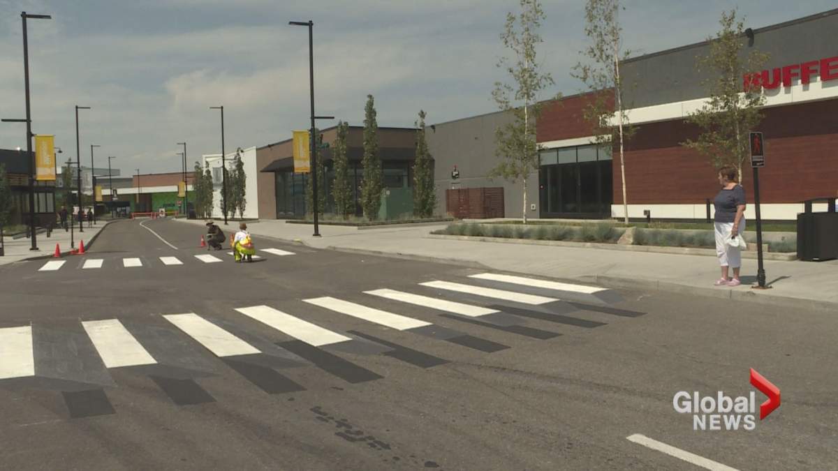 A 3D crosswalk is painted at Calgary’s Deerfoor City on Wednesday, July 31.