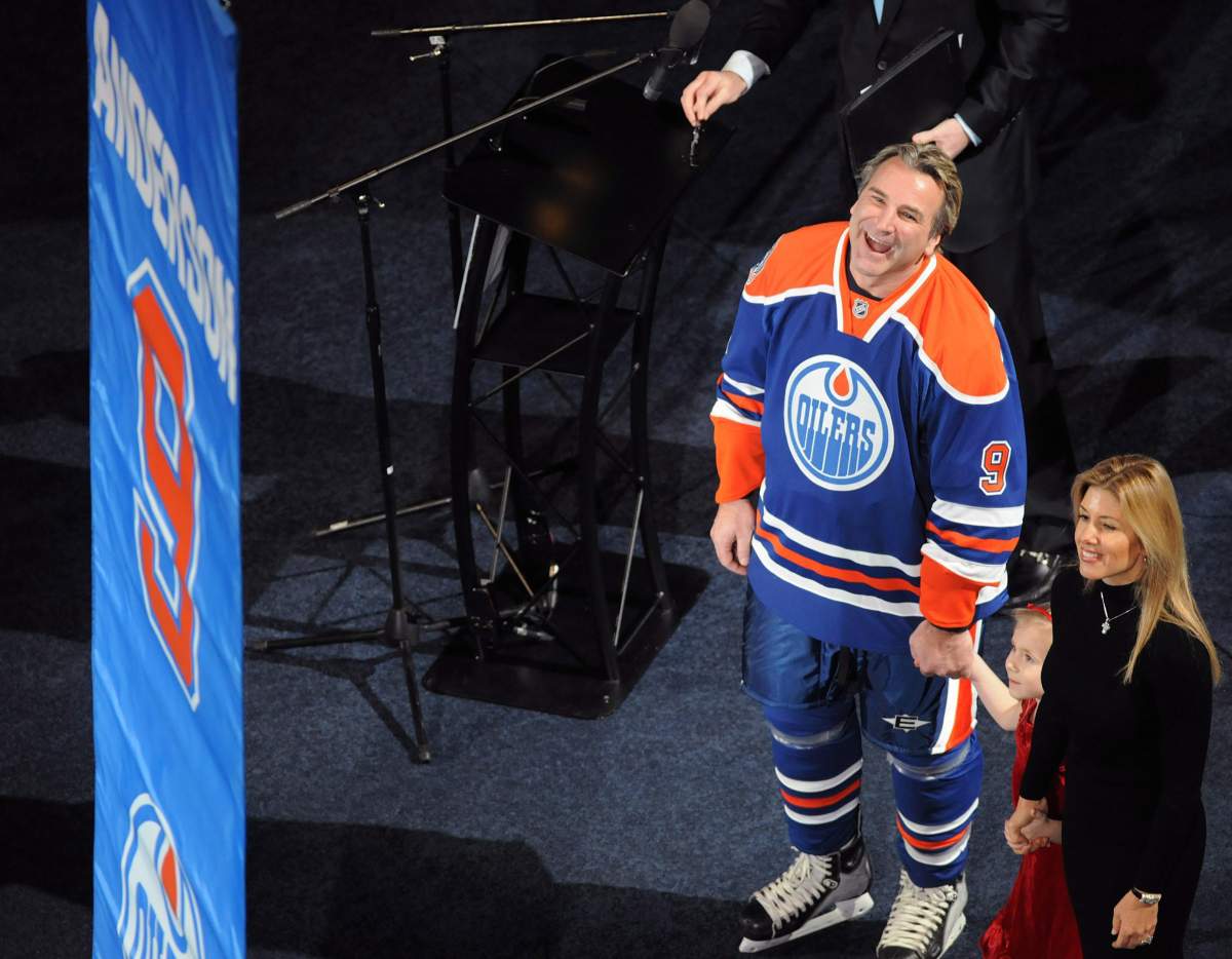Glenn Anderson, his daughter Autumn and wife Susan watch as his number is being raised prior to NHL hockey action against the Phoenix Coyotes in Edmonton on Sunday, January 18, 2009. Anderson who was inducted into the Hockey Hall of Fame also won five Stanley Cups from 1984-90 with the Oilers.