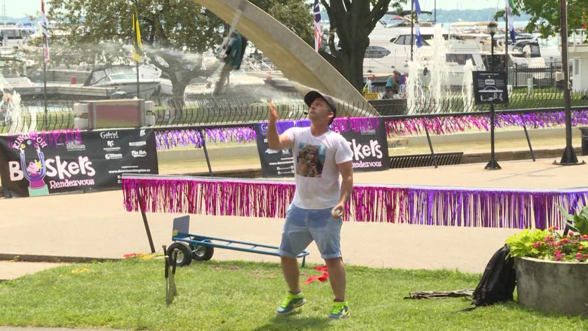 Kingston police charged a man with assault with a weapon for allegedly launching items at a crowd during Kingston's Busker's Rendezvous.