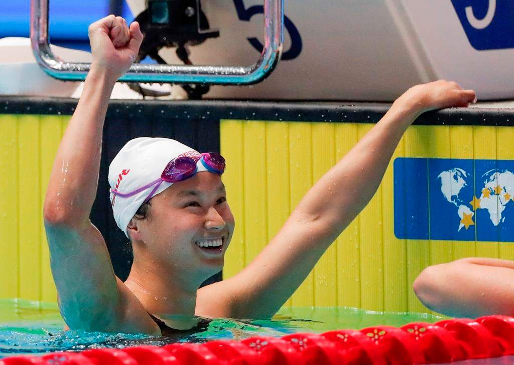 Canada's Margaret MacNeil reacts after winning the women's 100m butterfly final at the world swimming championships in Gwangju, South Korea, Monday, July 22, 2019.