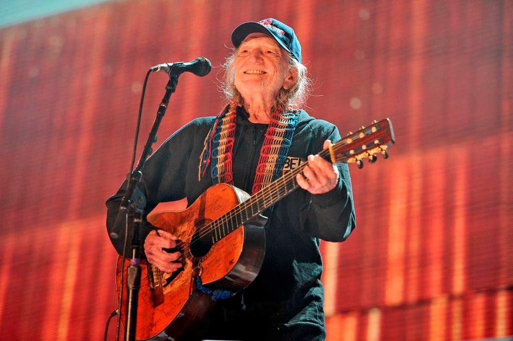 FILE - In this Sept. 19, 2015 file photo, Willie Nelson performs at Farm Aid 30 at FirstMerit Bank Pavilion at Northerly Island in Chicago. Nelson, John Mellencamp, Neil Young and Dave Matthews headline Farm Aid 2019 when the annual music and food festival visits Wisconsin's dairy country in September. Tickets for the Sept. 21 event at the Alpine Valley Music Theatre in East Troy, Wisconsin, go on sale Friday, July 12, 2019. (Photo by Rob Grabowski/Invision/AP, File).