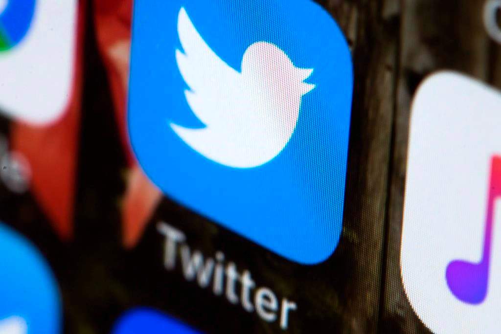 This Wednesday, April 26, 2017, photo shows the Twitter app on a mobile phone in Philadelphia. Twitter says it is launching an experiment in Canada today that will allow users in this country to hide replies to tweets on the social media platform. Other users globally will be able to see the feature and its use, but won't be able to use it themselves. THE CANADIAN PRESS/AP, Matt Rourke.