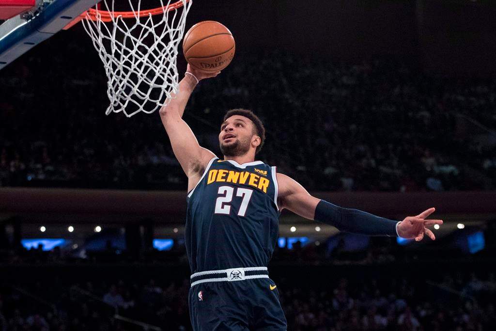 Denver Nuggets guard Jamal Murray goes to the basket during the first half of the team's NBA basketball game against the New York Knicks, Friday, March 22, 2019, at Madison Square Garden in New York. Jamal Murray's breakout NBA season has paid off. The 22-year-old from Kitchener, Ont., agreed to a five-year, US$170 million contract extension with the Denver Nuggets, the richest deal for a Canadian player in NBA history. THE CANADIAN PRESS/AP, Mary Altaffer.