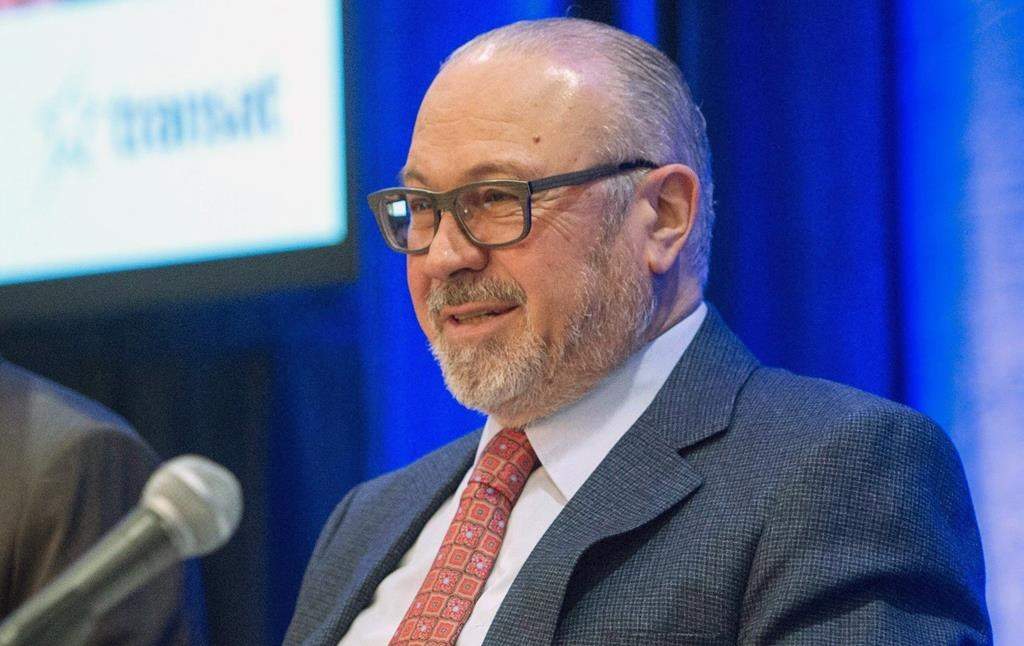 Air Transat founder and chief executive Jean-Marc Eustache prepares to start the company's annual meeting Thursday, March 10, 2016 in Montreal.