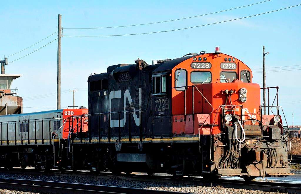 A CN locomotive makes its way through the CN Taschereau yard in Montreal on Nov., 28, 2009. Canadian National Railway says it is on track to move record quantities of western Canadian grain for the year after a strong June.THE CANADIAN PRESS/Graham Hughes.
