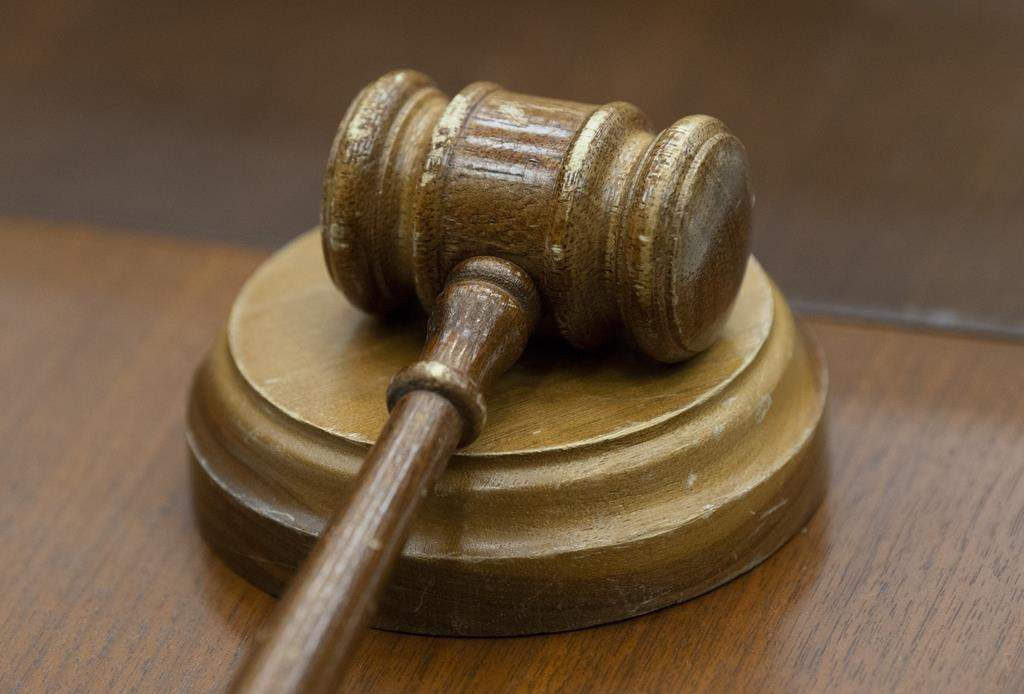 A gavel sits on a desk.