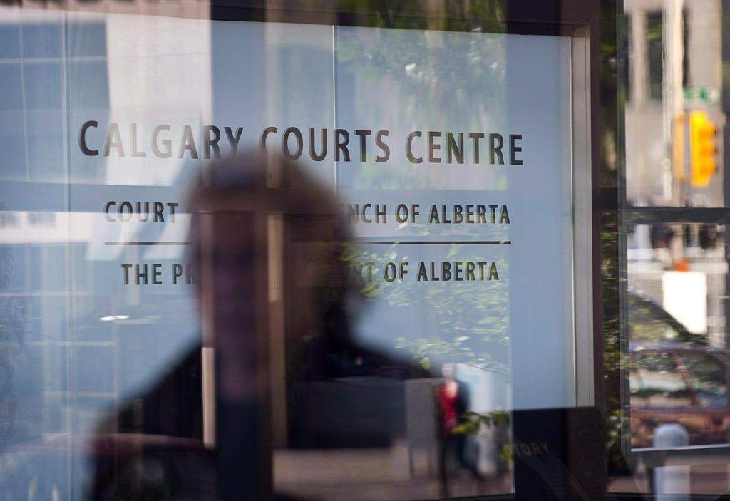 An entrance to the Calgary Courts Centre is shown in Calgary on Aug. 27, 2010. A class-action lawsuit filed on behalf of several young men accusing a former employee of The Young Canadians of sexual abuse has passed its first major hurdle.