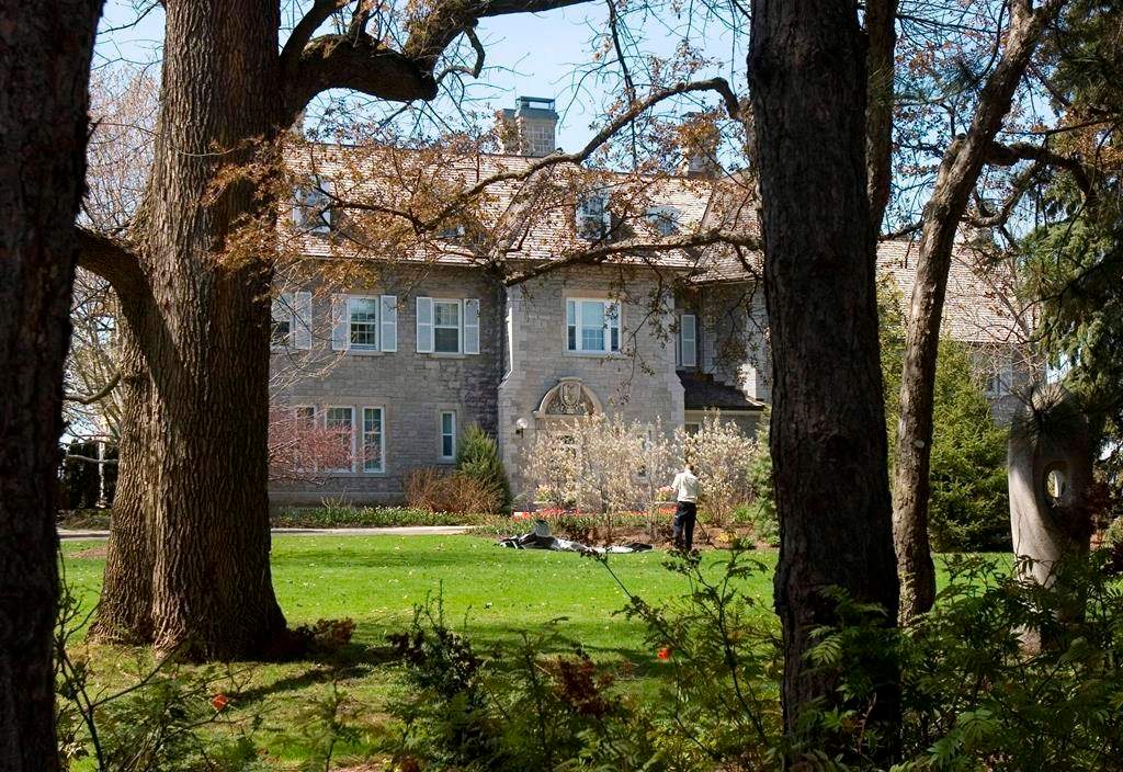 A gardener works on the grounds at the Prime Minister's residence at 24 Sussex Drive in Ottawa, Tuesday May 6, 2008.