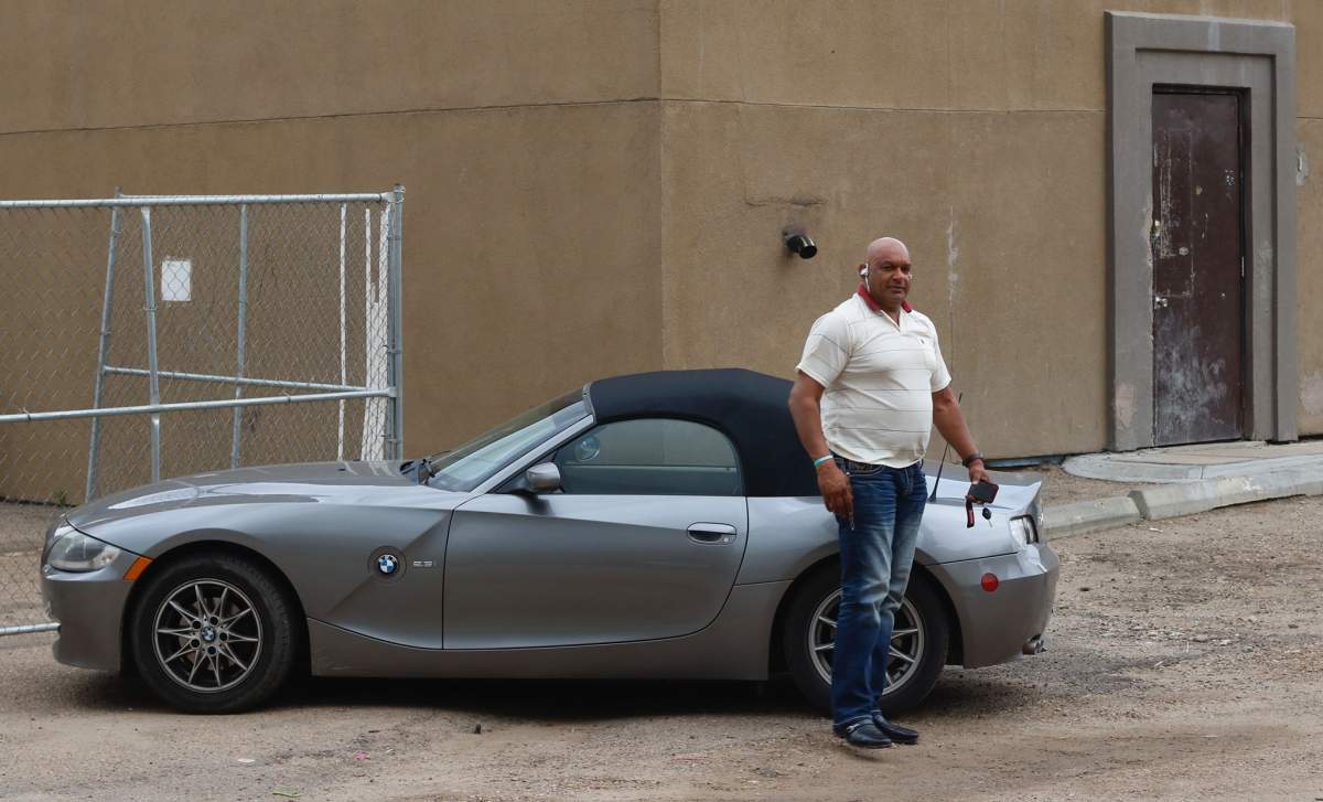 Edmonton landlord Abdullah Shah, also known as Carmen Pervez, behind a property along 111 Avenue near 93 Street in the McCauley neighbourhood, which was raided by the Edmonton Police Service and Canadian Revenue Agency on Wednesday, July 24, 2019.