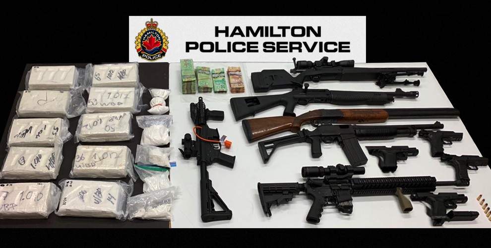 Hamilton police show off guns and drugs seized at a west mountain home on Wednesday.