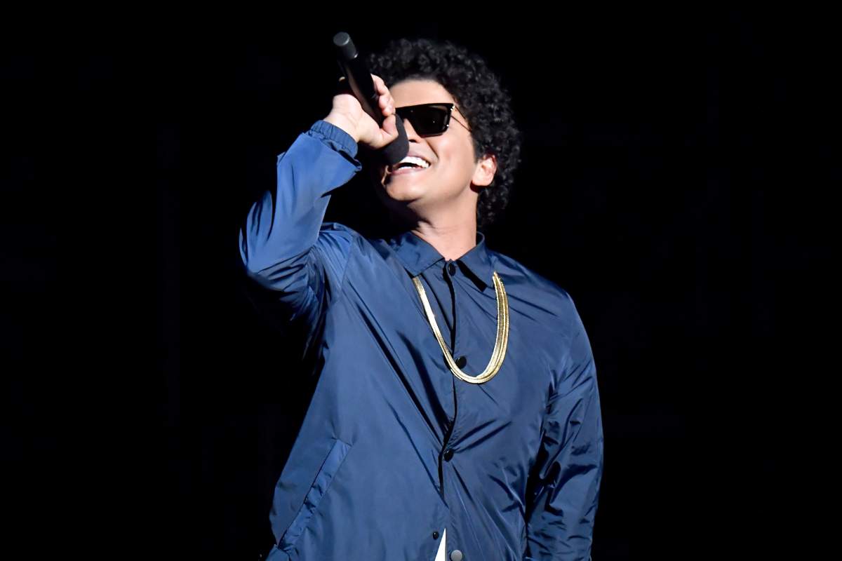 Bruno Mars speaks onstage during the 2018 Billboard Music Awards at MGM Grand Garden Arena on May 20, 2018 in Las Vegas, Nev.