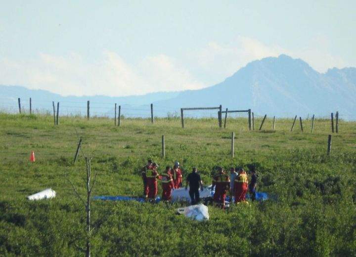 Emergency crews at the scene of a deadly glider crash in southern Alberta on Friday, July 26, 2019.