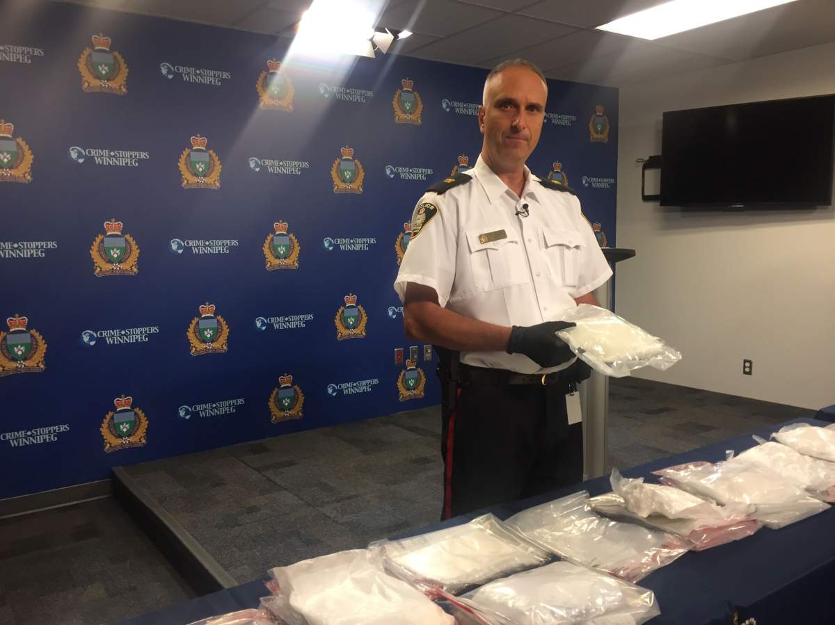 Insp. Max Waddell with a haul of drugs that included cocaine, purple heroin and methamphetamine.