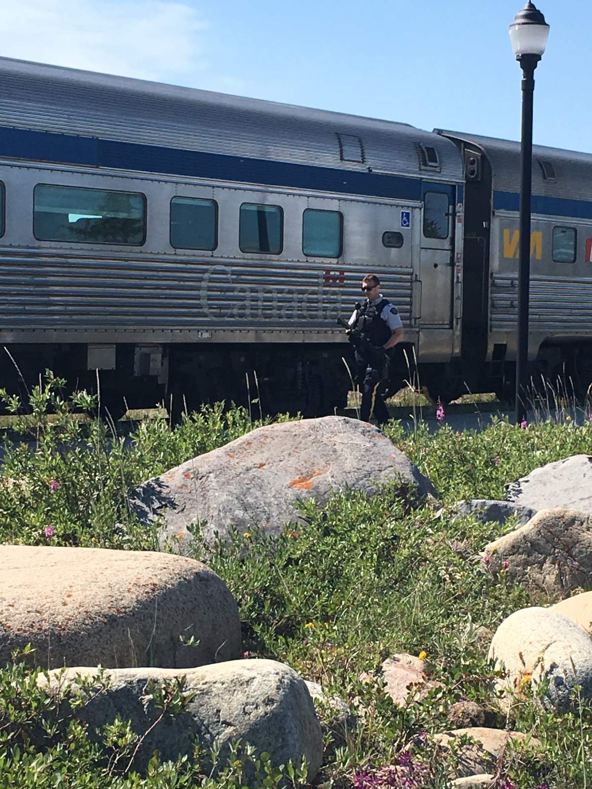 An increased presence of RCMP officers was on scene at the train station in Churchill, Man., after they say that two murder suspects were last seen nearby.