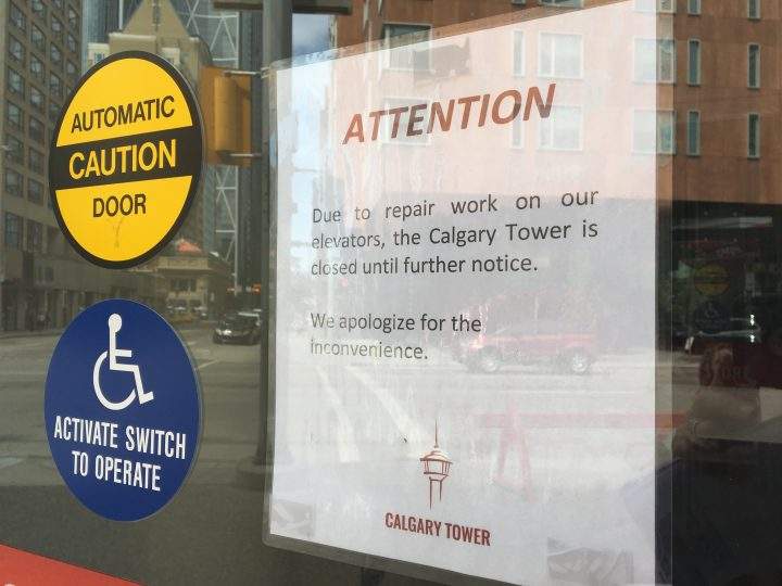 A sign posted at the doors of the Calgary Tower on Sunday.