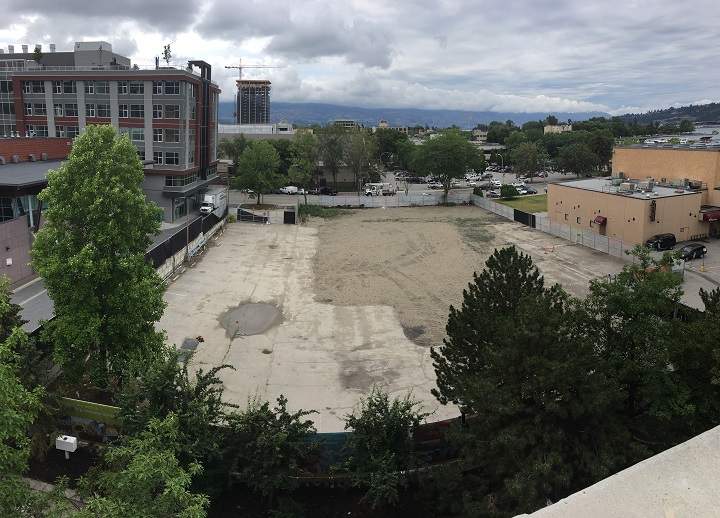 A view of the empty lot at 350 Doyle Avenue in downtown Kelowna. At left is the Okanagan Innovation Centre. At right is the Kelowna Community Theatre, with Okanagan Lake just across the street from that.