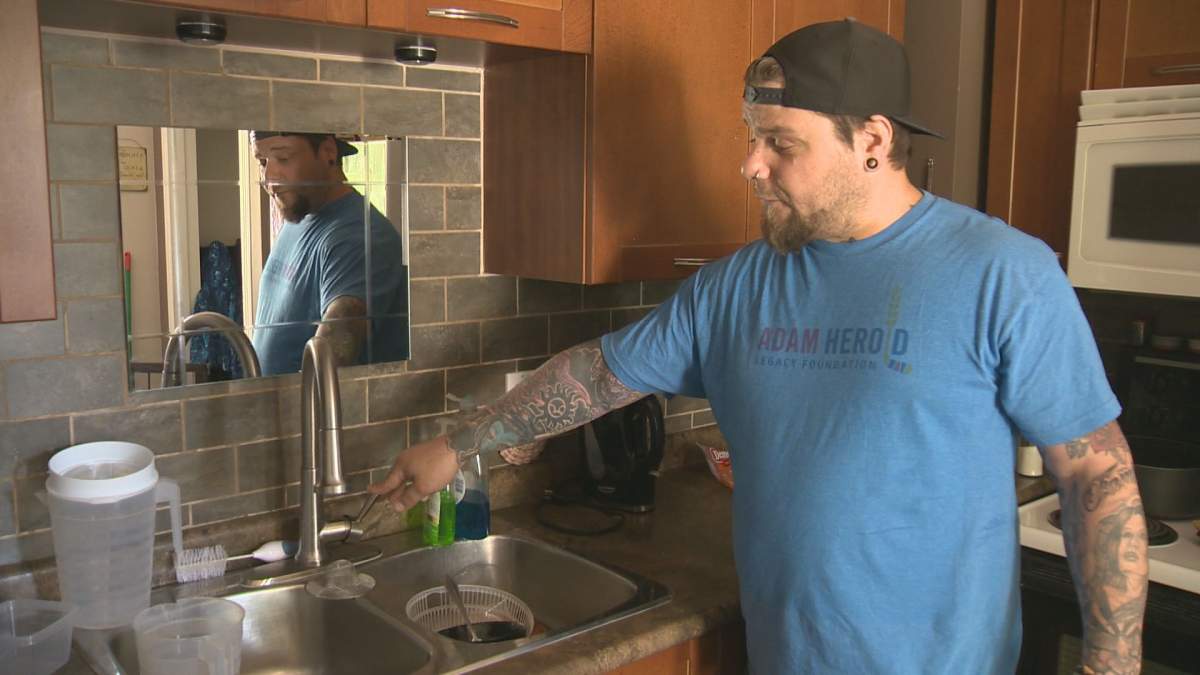 Klym Mainland shows water is not running from his taps. He says it's due to a nearby water main break. 