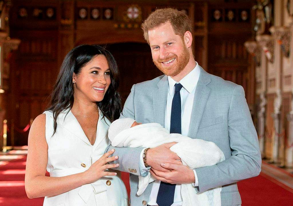 Harry and Meghan pose for photographs with their newly born Archie