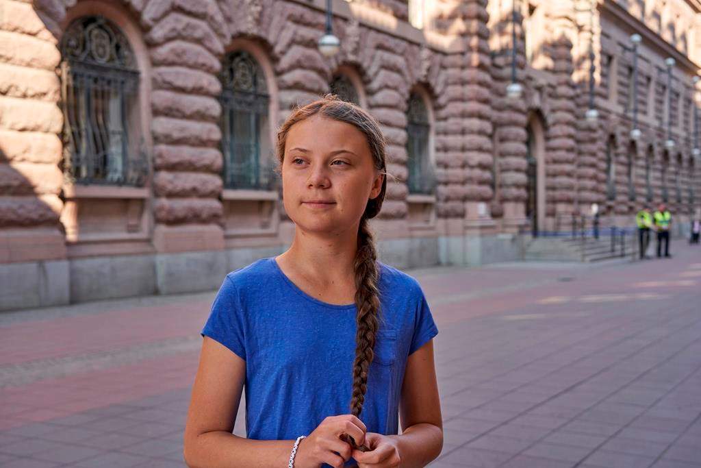 Greta Thunberg stands next to Swedish Parliament in Stockholm on July 26, 2019.