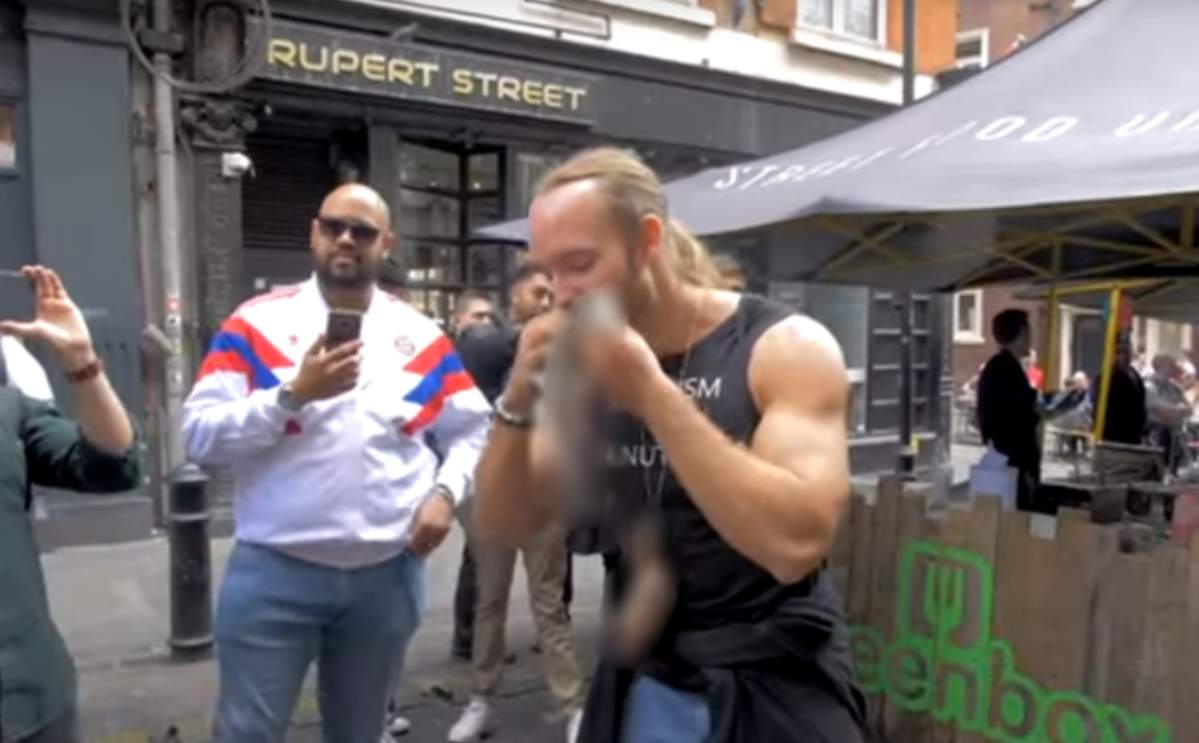 A pro-meat protesters ate raw squirrel at a vegan market in London.