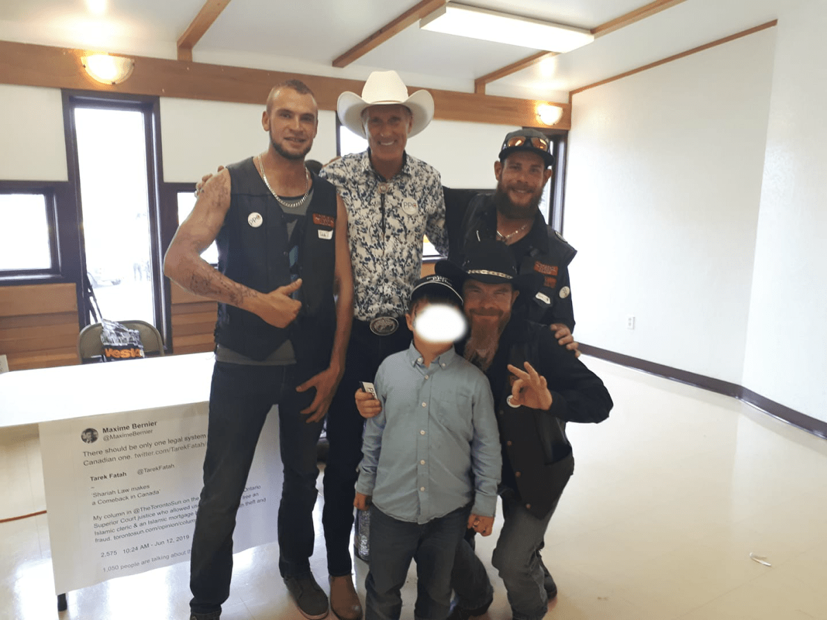 People’s Party of Canada leader Maxime Bernier, in white cowboy hat, poses with members of the Northern Guard in a Facebook photo.