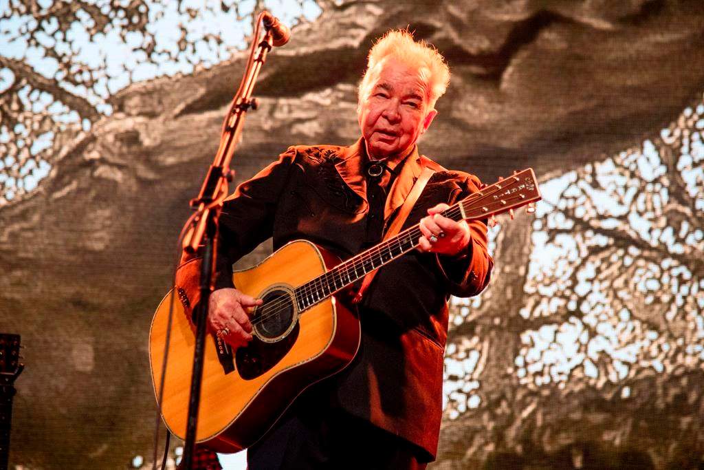 This June 15, 2019 file photo shows John Prine performing at the Bonnaroo Music and Arts Festival in Manchester, Tenn.