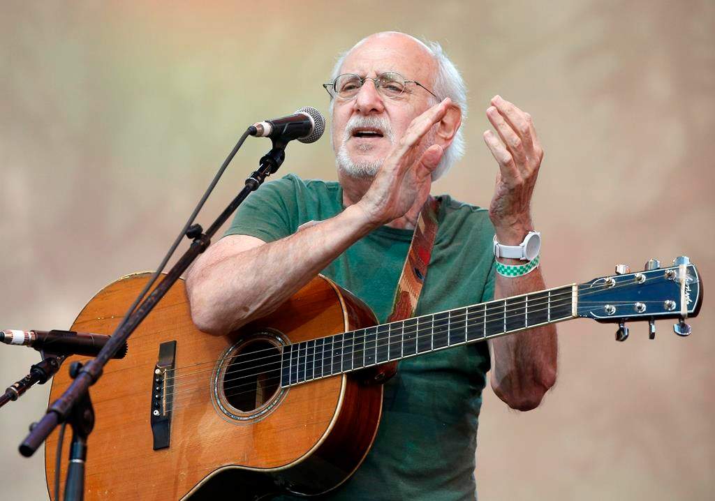 FILE - In this July 20, 2014, file photo, singer-songwriter Peter Yarrow, of the 1960's era musical trio "Peter Paul and Mary," claps and encourages the audience to sing along during a memorial tribute concert for folk icon and civil rights activist Pete Seeger at Lincoln Center's Damrosch Park in New York.