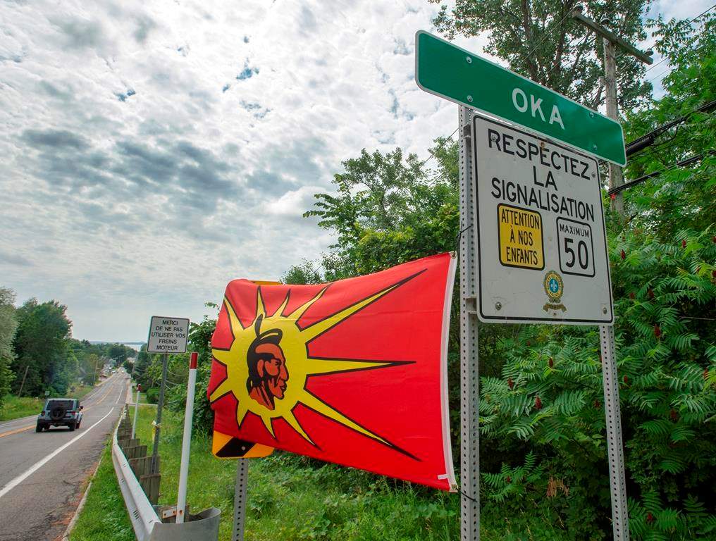 Mohawk flags are placed at the border of the Kanasatake Mohawk territory and the town of Oka Friday, July 19, 2019 in Oka, Quebec.
