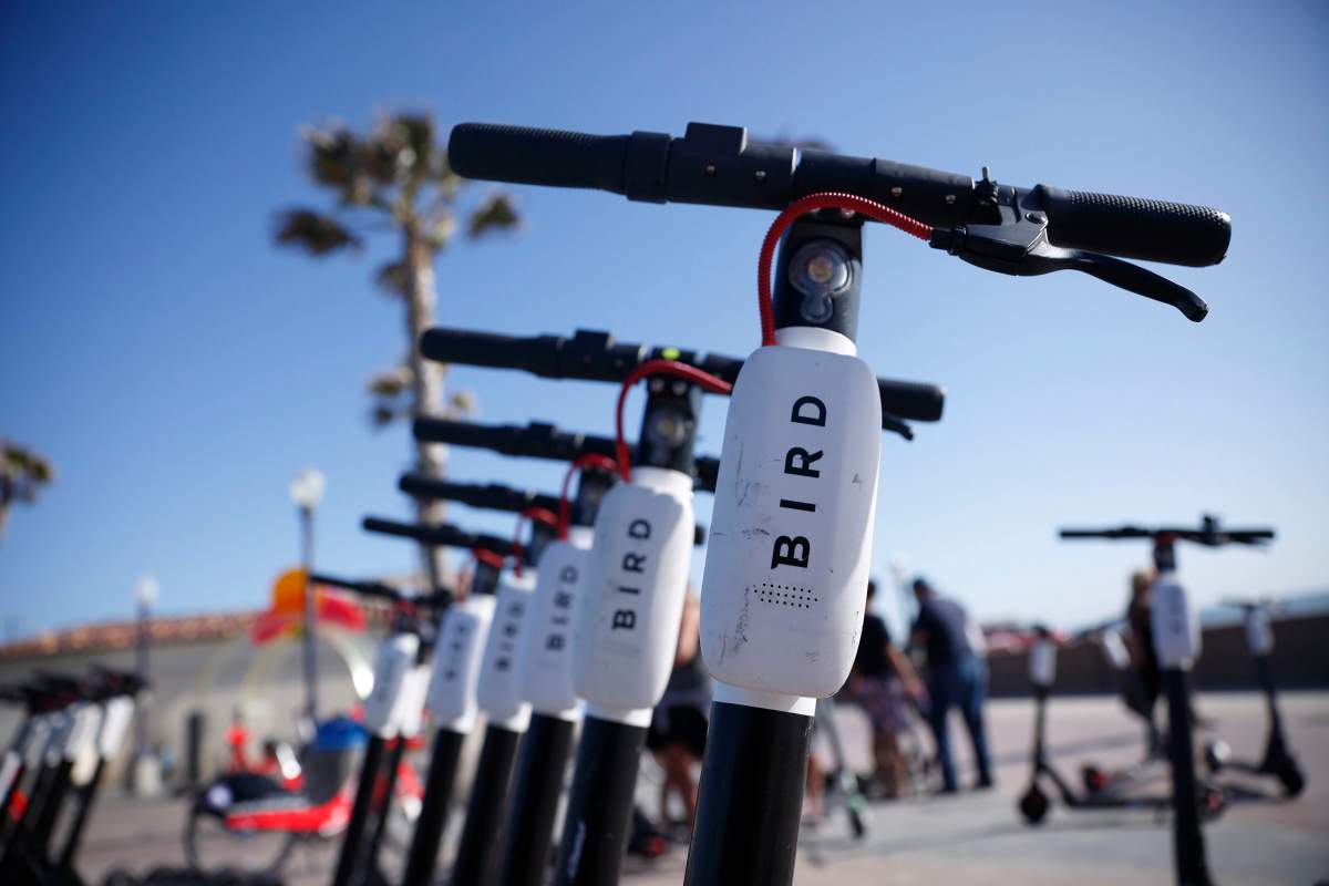 In this May 28, 2019, file photo Bird scooters are seen along Mission Beach boardwalk in San Diego.