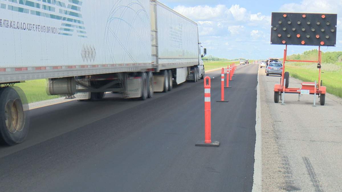 Drivers are required to slow to 60 km/h or the speed that’s posted when passing a highway worker, flag person or highway equipment with warning lights flashing. 