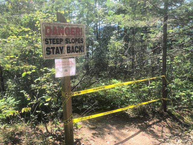 A view of the Lizard Trail with tape blocking access to the public after a fatal accident.