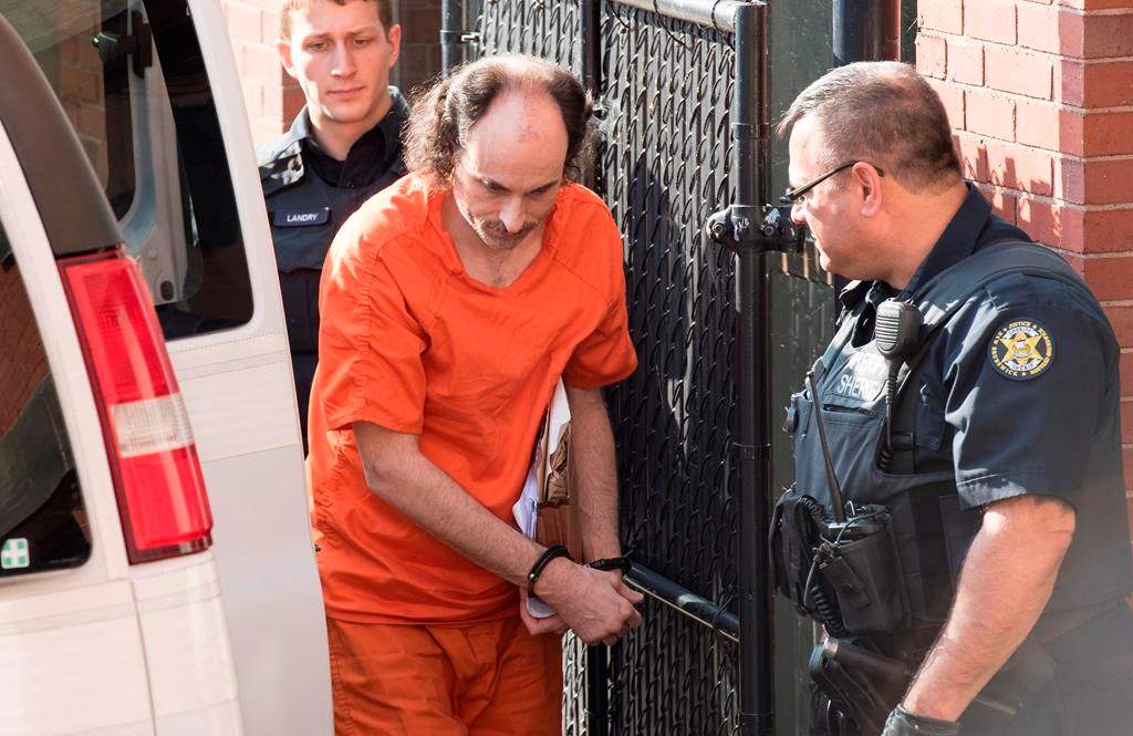 Matthew Vincent Raymond arrives at provincial court in Fredericton on Friday, July 26, 2019. Raymond is charged with four counts of first-degree murder in the deaths of Fredericton police constables Sara Burns and Robb Costello, and civilians Donnie Robichaud and Bobbie Lee Wright.