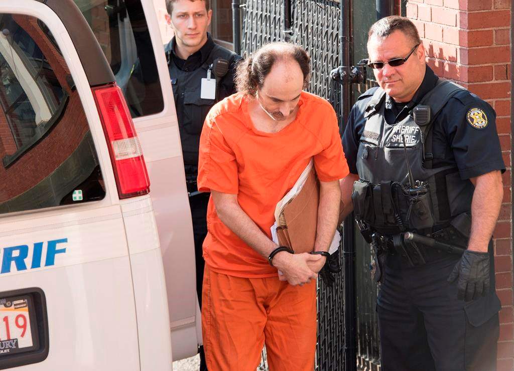 Matthew Vincent Raymond arrives at provincial court in Fredericton on Friday, July 26, 2019. Raymond is charged with four counts of first-degree murder in the deaths of Fredericton police constables Sara Burns and Robb Costello, and civilians Donnie Robichaud and Bobbie Lee Wright. THE CANADIAN PRESS/Stephen MacGillivray.